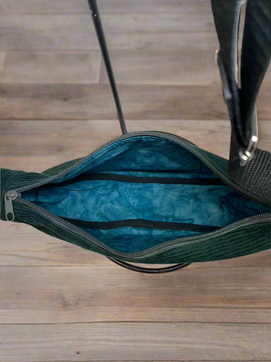 Inside of the Emerald green corduroy hobo shoulder bag. Blue-green ocean watercolor cotton lining.