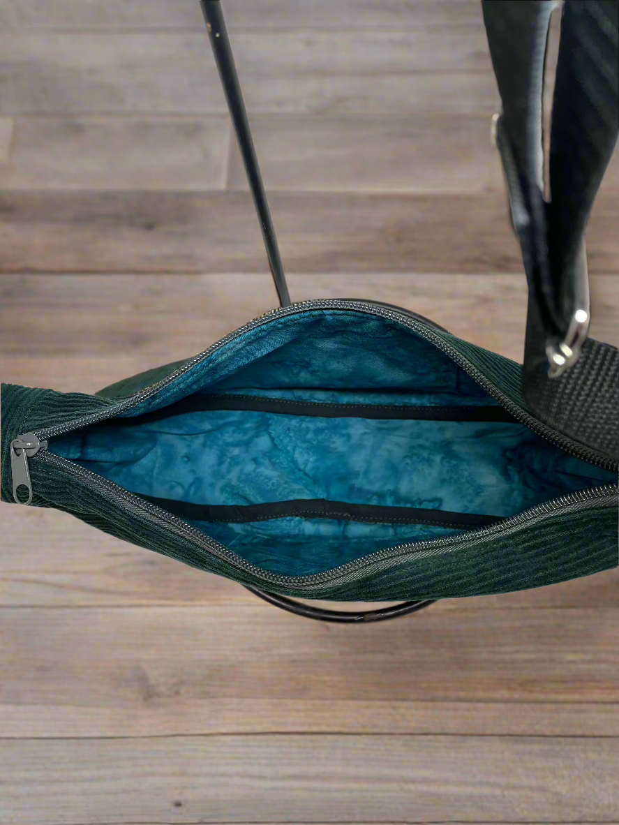 Inside of the Emerald green corduroy hobo shoulder bag. Blue-green ocean watercolor cotton lining. 